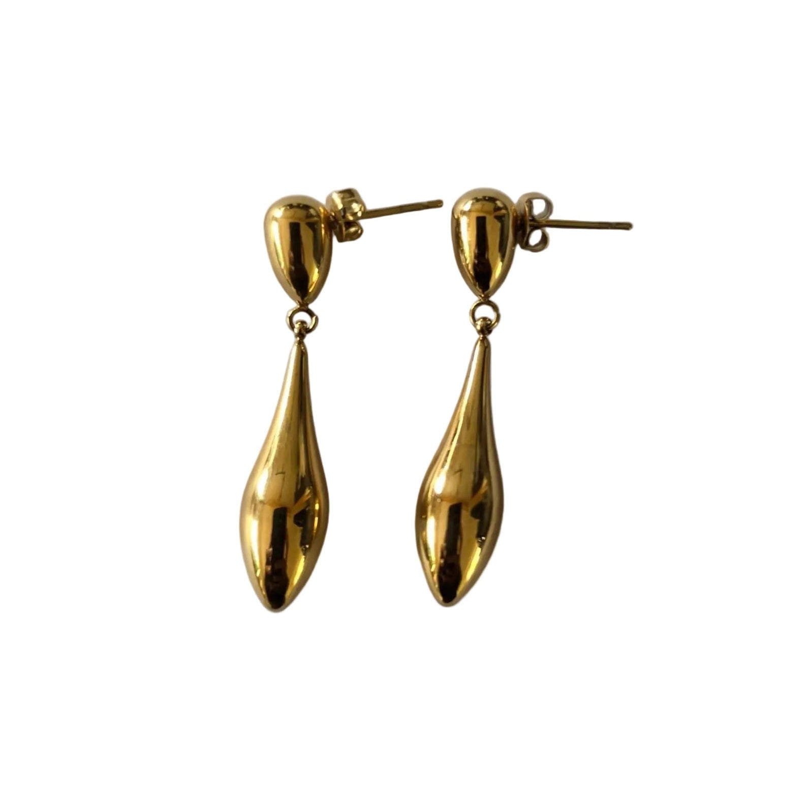 Gold teardrop earrings on a light gray background